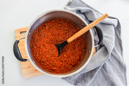 homemade vegetarian lentil bolognese sauce in big pot on kitchen counter