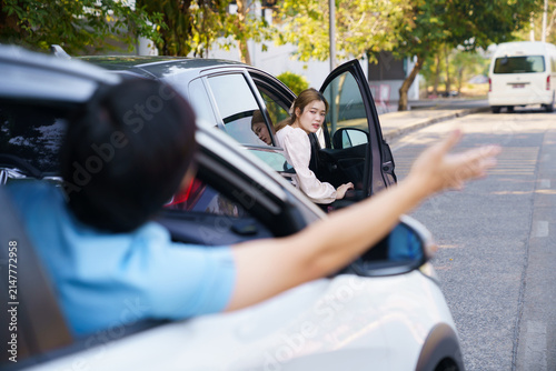 Angry drivers arguing after road accident during traffic dispute outdoors