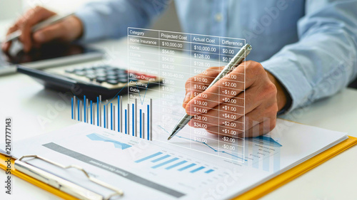 Businessman analyzing futuristic virtual financial charts and data on holographic interface screen