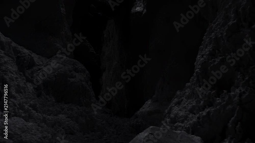 Dark limestone cave interior with narrow chasm, steep textured walls, rocky floor, deep shadow, rough mineral surfaces, moody contrast, and recessed viewpoint, with cave, limestone, chasm, dark detail