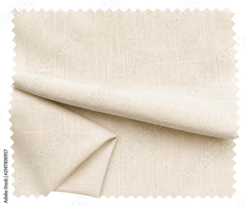 A folded swatch of natural beige linen fabric with a visible woven texture isolated on black background