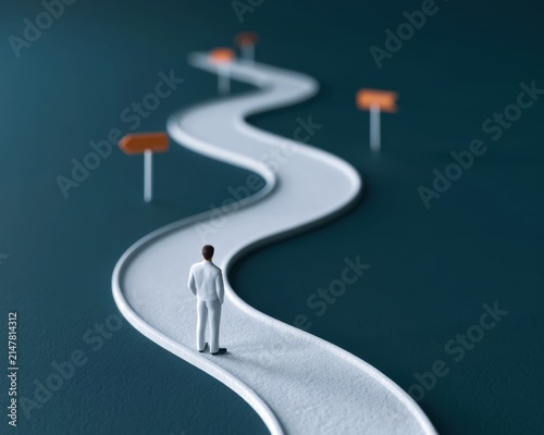 A lone individual walking along a twisting trail surrounded by directional markers in a simple and clean environment