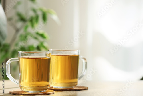 Two clear glass mugs filled...