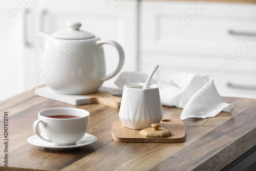 White ceramic teapot, sugar...