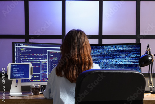 Female programmer coding on...
