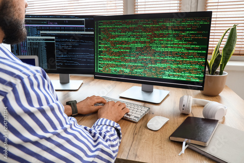 Male programmer coding on c...
