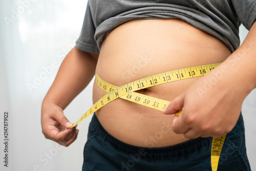 Quadro su tela Asian woman with fat belly big size overweight and obesity with measure tape