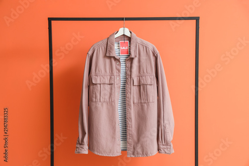 Rack with shirts and sale t...
