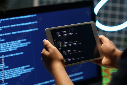 Programmers hands with mode...
