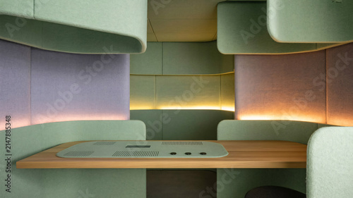 Office workstation featuring acoustic privacy panels and soft ambient lighting provides a modern quiet space for focused work.