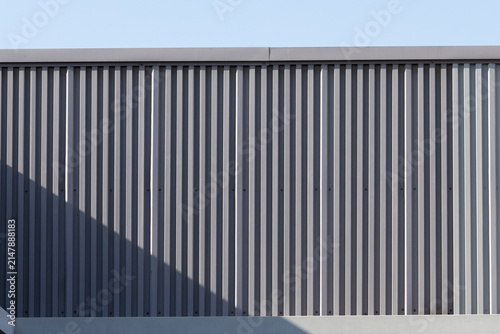 Close-up of textured metal siding under clear sky