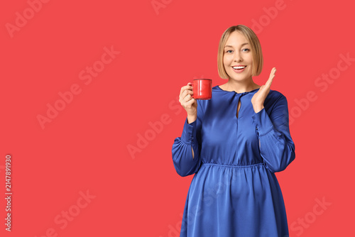 Happy adult woman with cup ...