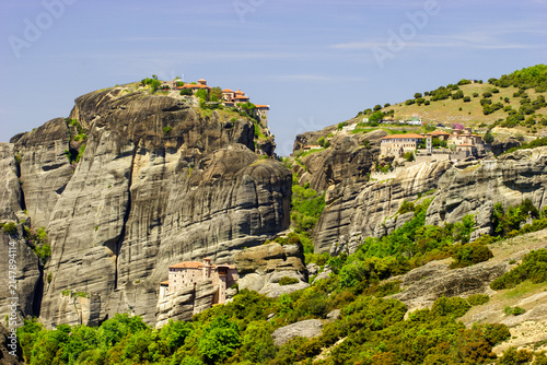 Canvas Print The Meteora Monasteries in Greece, perched atop towering rock formations, under a clear blue sky