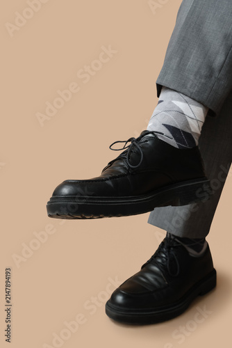 Legs of young man in black ...