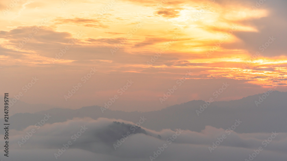 Fototapeta premium Morning sunrise, Blue Sky white Clouds over mountains and mist cover high land, Horizon sky landscape Background at Betong, Yala, Thailand
