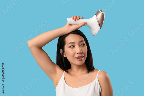 Pretty Asian woman with pho...