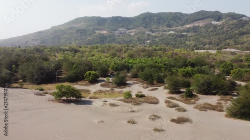 Aerial View of Gumuk Pasir Parangkusumo Sand Dunes with Coastal Forest and Hills in Yogyakarta, Indonesia