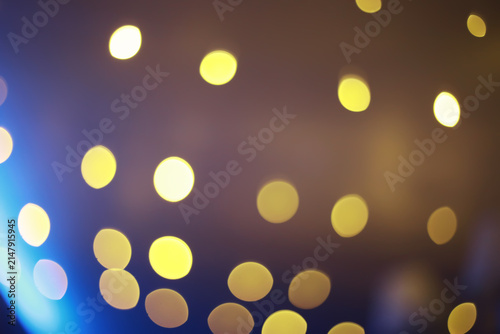 Abstract bokeh background. Golden bokeh circles on dark blue background. Layer overlay.