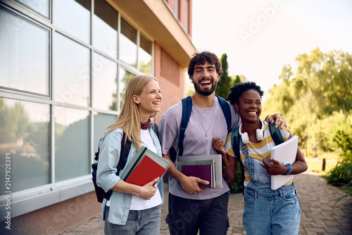 Cheerful college friends having fun at campus.