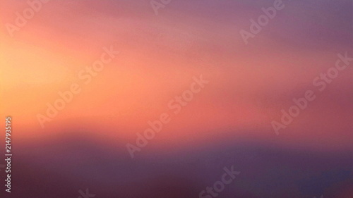 Soft gradient of warm orange and purple hues creates a serene abstract sky.