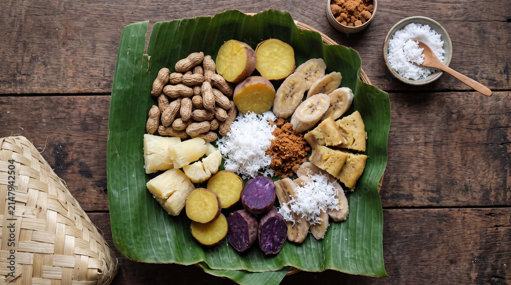 Fototapeta premium Traditional Indonesian Boiled Snacks Platter on Banana Leaf