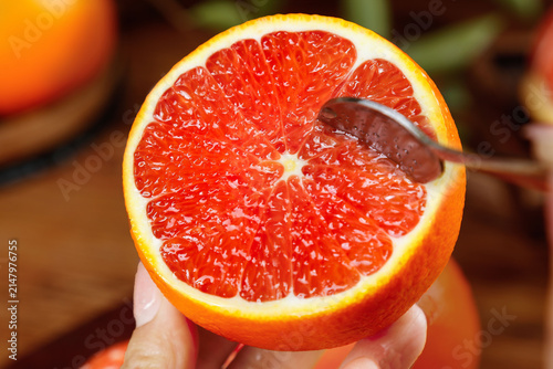 Fresh Red Blood Orange from Gannan Jiangxi China with Spoon Showing Juicy Citrus Segments