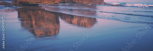 Seascape in the morning. Rocky sea coast at sunrise. Beach Playa de Las Catedrales in Ribadeo, Galicia, Spain, Europe