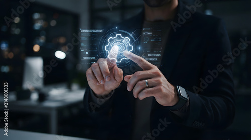 A professional businessman interacting with a futuristic digital interface showing a gear icon representing engineering innovation and advanced corporate technology solutions