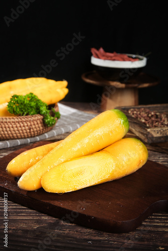 Fresh Yellow Xinjiang Carrots on Wooden Board - Seasonal Farm Vegetables