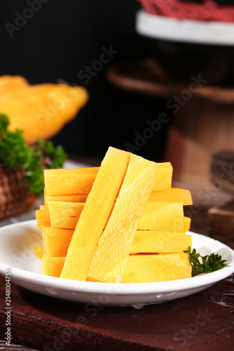 Fresh Yellow Carrot Sticks from Xinjiang Farm - Healthy Seasonal Vegetable Snack on Rustic Wooden Table