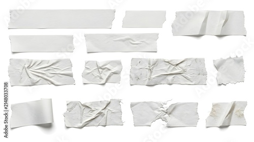 Set of white adhesive masking tape pieces with wrinkled torn edges isolated on white background texture