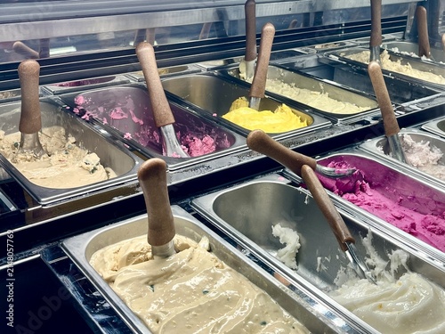 Принти на полотні Variety of gelato and ice cream flavors in display freezer bins