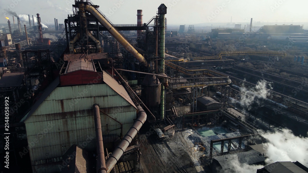 Fototapeta premium Factory, industrial enterprise, metallurgical plant, smoke from chimneys, aerial photography from a drone.