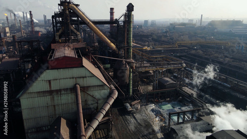 Factory, industrial enterprise, metallurgical plant, smoke from chimneys, aerial photography from a drone.