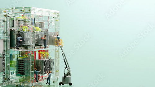 Miniature engineers servicing a glass server cabinet