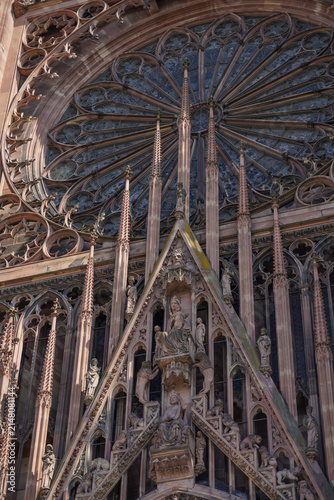 Konstfotografi Detailed ornate gothic facade of a historic European cathedral with intricate stone carvings and a rose window