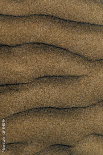Natural Beach Sand Texture with Wave-Like Patterns and Earth Tones