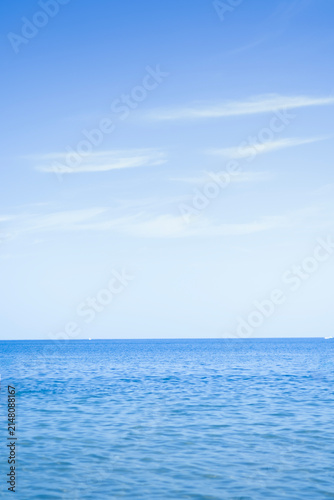 Blue sea and clear sky horizon. Calm ocean water surface.