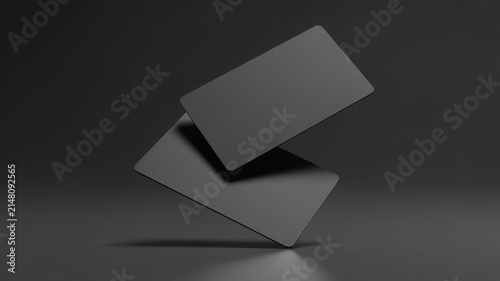 Two floating blank black business cards mockup on a dark grey background