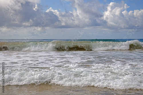 Bild auf Leinwand Crystal-clear waters and great waves for surfers and bodyboarders on Kealia Beach, just north of Kapaa, Kauai, Hawaii