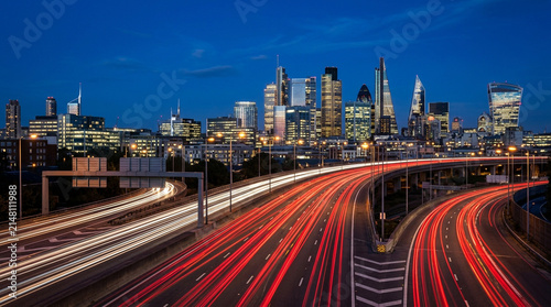 Night Urban Highway Traffic Light Trails with Modern City Skyline and Metropolitan Infrastructure