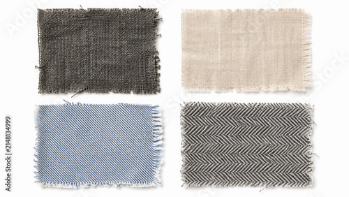 Foto Set of four rectangular textile swatches with frayed edges including denim and l