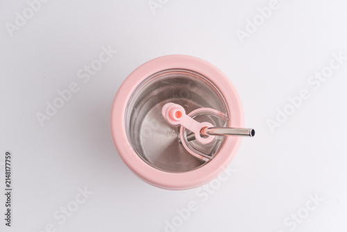 Pink reusable cup tumbler with cute black cat design and metal straw isolated on white
