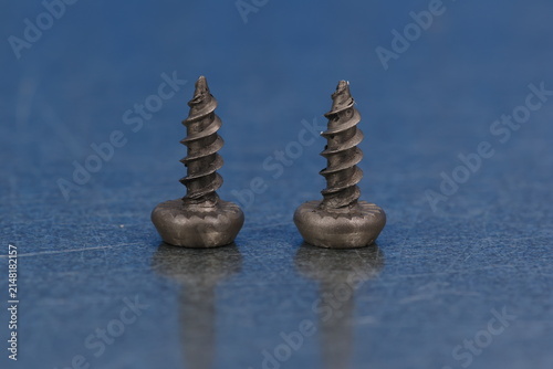 Metal screws for fastening equipment. Soft focus. Close-up. 