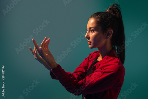 Latin woman dancer performing expressive hand gesture