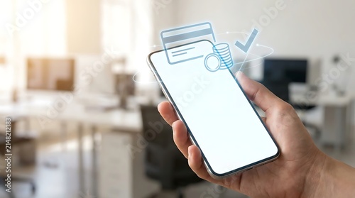 Hand holding smartphone with digital payment app screen. Mobile banking transaction interface on modern touchscreen device.