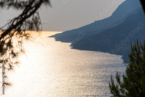 Golden evening light over the Adriatic coast below Biokovo mountain near Makarska, Dalmatia, Croatia.