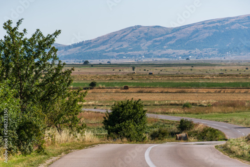 Dry summer fields and hay bales below Biokovo in the Bosnian hinterland 