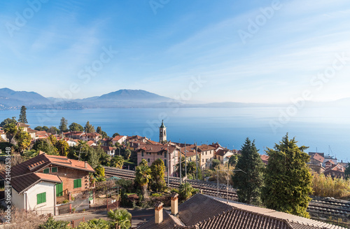 Panoramic view of Lake Maggiore from the village of Belgirate with mountains and blue waters, Piedmont, Italy