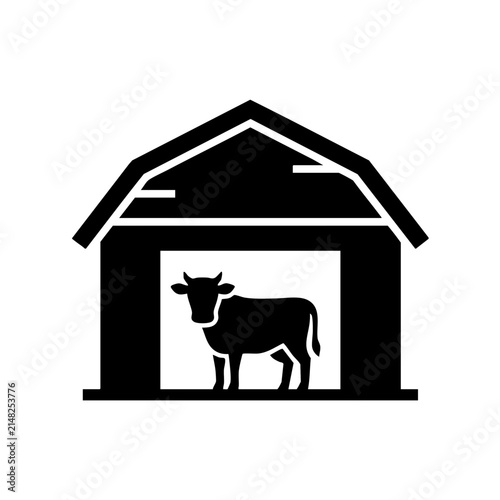 Black barn with cow silhouette inside